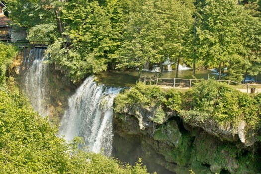 Waterfalls in green nature of Korana river, village of Rastoke