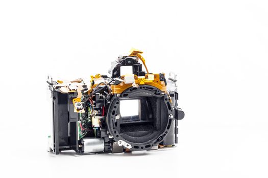 Picture of a disassembled photo camera on white background