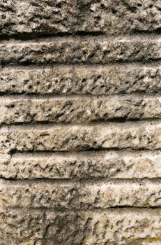 Old white and gray stone with crystals and moss, textured with grooves