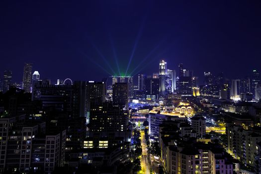 View of Singapore cityscape at night, with lightshow