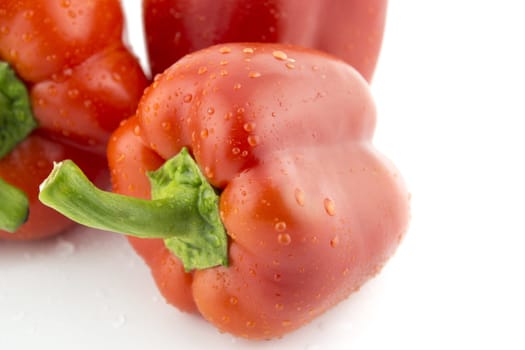 Red sweet pepper on a white background .