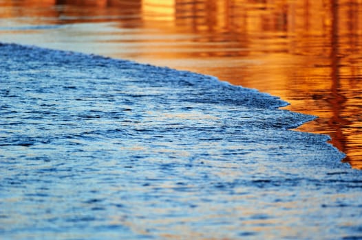 Soft wave of the sea on the sandy beach in evening