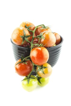 fresh cherry tomatoes with water drops on white background