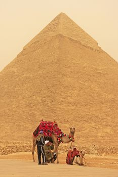Bedouins resting near Pyramid of Khafre during sand storm, Cairo, Egypt