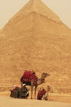 Bedouins resting near Pyramid of Khafre during sand storm, Cairo, Egypt