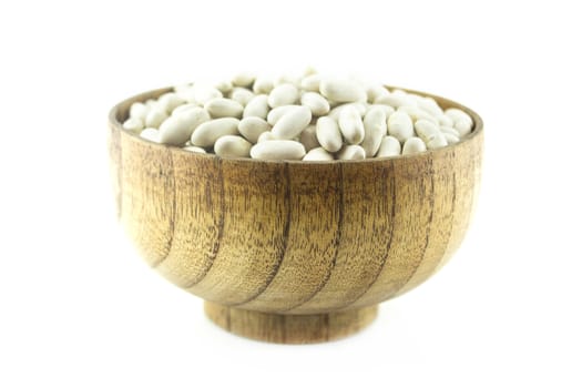 Pile Lima Bean in wooden plate isolated on white background