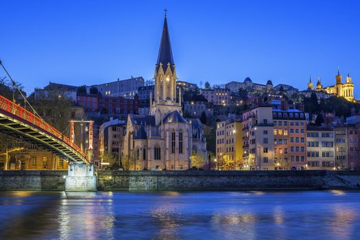 Famous church in Lyon with Saone river at night