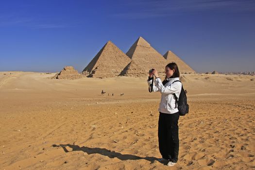Tourist taking picture at Great Pyramids of Giza, Cairo, Egypt