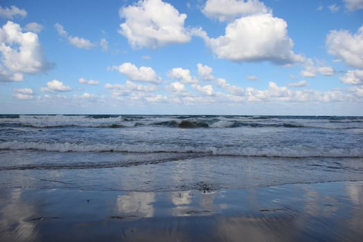 seascape on a background of clouds and blue sky