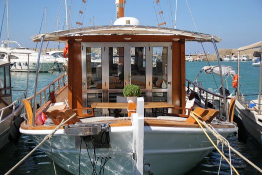 small boat standing on the dock at the seaport






























