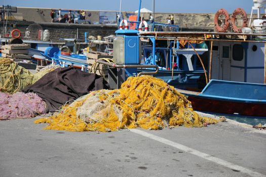 fishing nets spread out on a sea berth