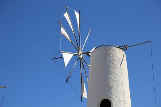 traditional Greek windmill against the blue sky