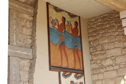 restored ancient frescoes on the walls of the ancient palace