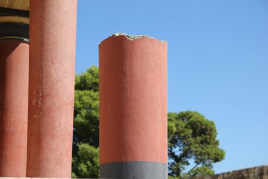 columns of an ancient palace on a background of blue sky
