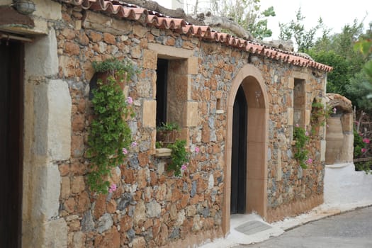 Greek village house with a tiled roof