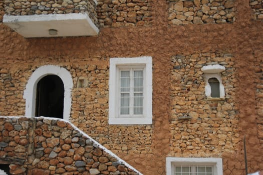 ancient Greek house with a stone staircase