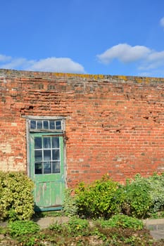 Red brick wall and door