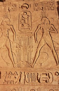 Ancient hieroglyphics on the wall of Great temple of Abu Simbel, Nubia, Egypt