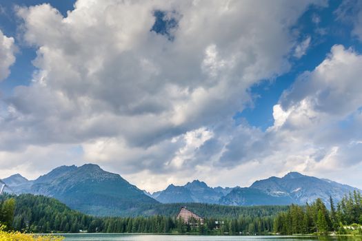 Clouds over mountain lake in National Park High Tatra. Strbske pleso, Slovakia, Europe