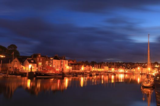 Town Lights Light up Weymouth Quay as Night Sets in in Dorset