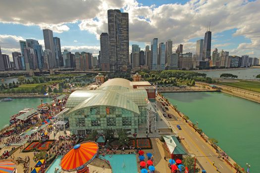 CHICAGO, ILLINOIS - SEPTEMBER 4: Aerial view of Navy Pier in Chicago, Illinois with a skyline background on September 4, 2011. The Pier is a popular destination with many attractions on Lake Michigan.