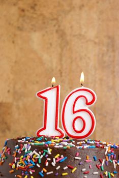A number candle represents sixteen sweet years worth celebrating.