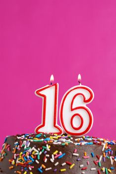 A number candle represents sixteen sweet years worth celebrating.