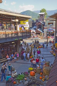 GATLINBURG, TENNESSEE - OCTOBER 5: Tourists in downtown Gatlinburg, Tennessee on October 5, 2013. Gatlinburg is a popular tourist destination and gateway city to Great Smoky Mountains National Park.