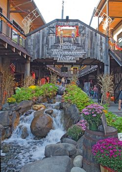 GATLINBURG, TENNESSEE - OCTOBER 5: Tourists in downtown Gatlinburg, Tennessee on October 5, 2013. Gatlinburg is a popular tourist destination and gateway city to Great Smoky Mountains National Park.