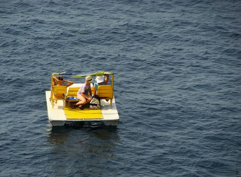 Tourists resting on catamaran, Simeiz, Crimea peninsula, Ukraine