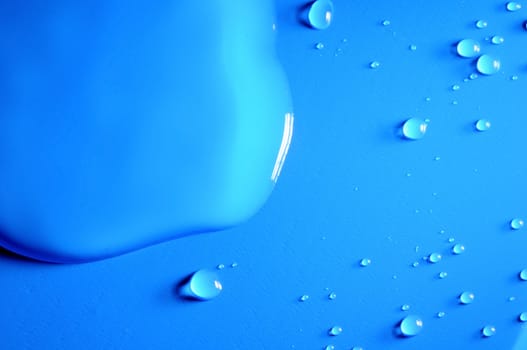 Some Water Drops on a Blue Textured Background
