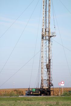land oil drilling rig on field