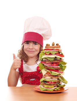 little girl cook with tall sandwich and thumb up