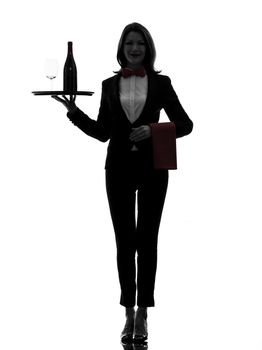 one caucasian woman waiter butler serving red wine in silhouette  on white background