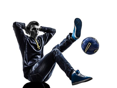 one caucasian young man soccer freestyler player  in silhouette  on white background