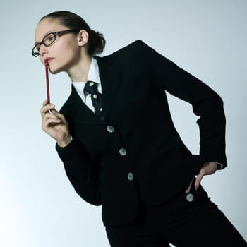 studio shot portrait of one business  woman thinking