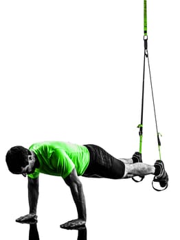 one caucasian man exercising   suspension training  trx   on white background