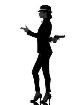 one stylish caucasian woman in suit holding gun in silhouette  on white background