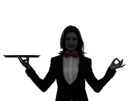 one caucasian woman waiter butler holding empty tray zen gesturing in silhouette  on white background