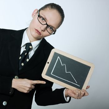 studio shot portrait of one serious business woman holding graphic board with deacreasing curve