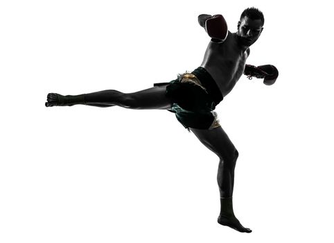 one caucasian man exercising thai boxing in silhouette studio  on white background