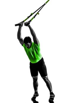 one caucasian man exercising   suspension training  trx   on white background