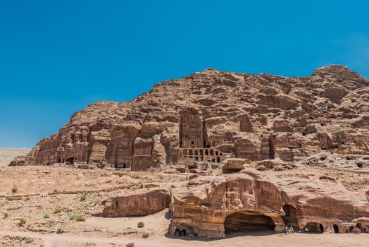 Petra, Jordan - May 10, 2013: tourists visiting Royal tombs in nabatean petra jordan middle east on may 10th, 2013