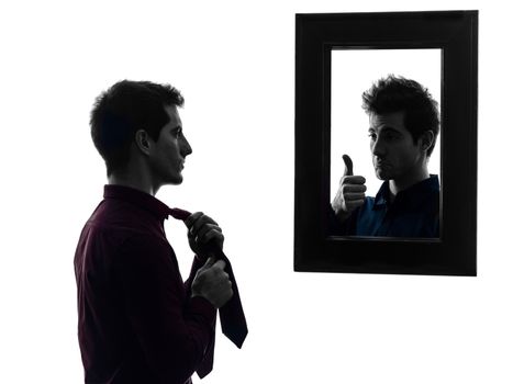 man in front of his mirror  man in front of his mirror  in shadow  white background