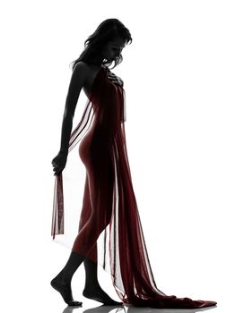 one beautiful asian woman naked behind red veil  in silhouette studio isolated on white background
