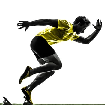 one caucasian man young sprinter runner  in starting blocks  silhouette studio  on white background