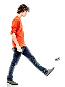 one young man caucasian kicking tin can sad bore side view   in studio white background