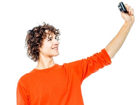 one young man caucasian holding camera photographing portrait  in studio white background