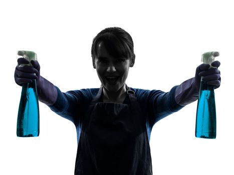 one caucasian woman maid window cleaning sprayer   in silhouette studio isolated on white background