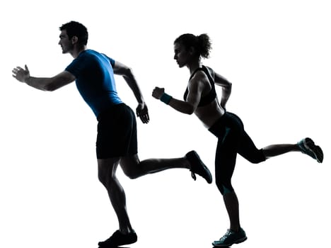 one caucasian couple man woman personal trainer coach runner running jogging sprinting silhouette studio isolated on white background